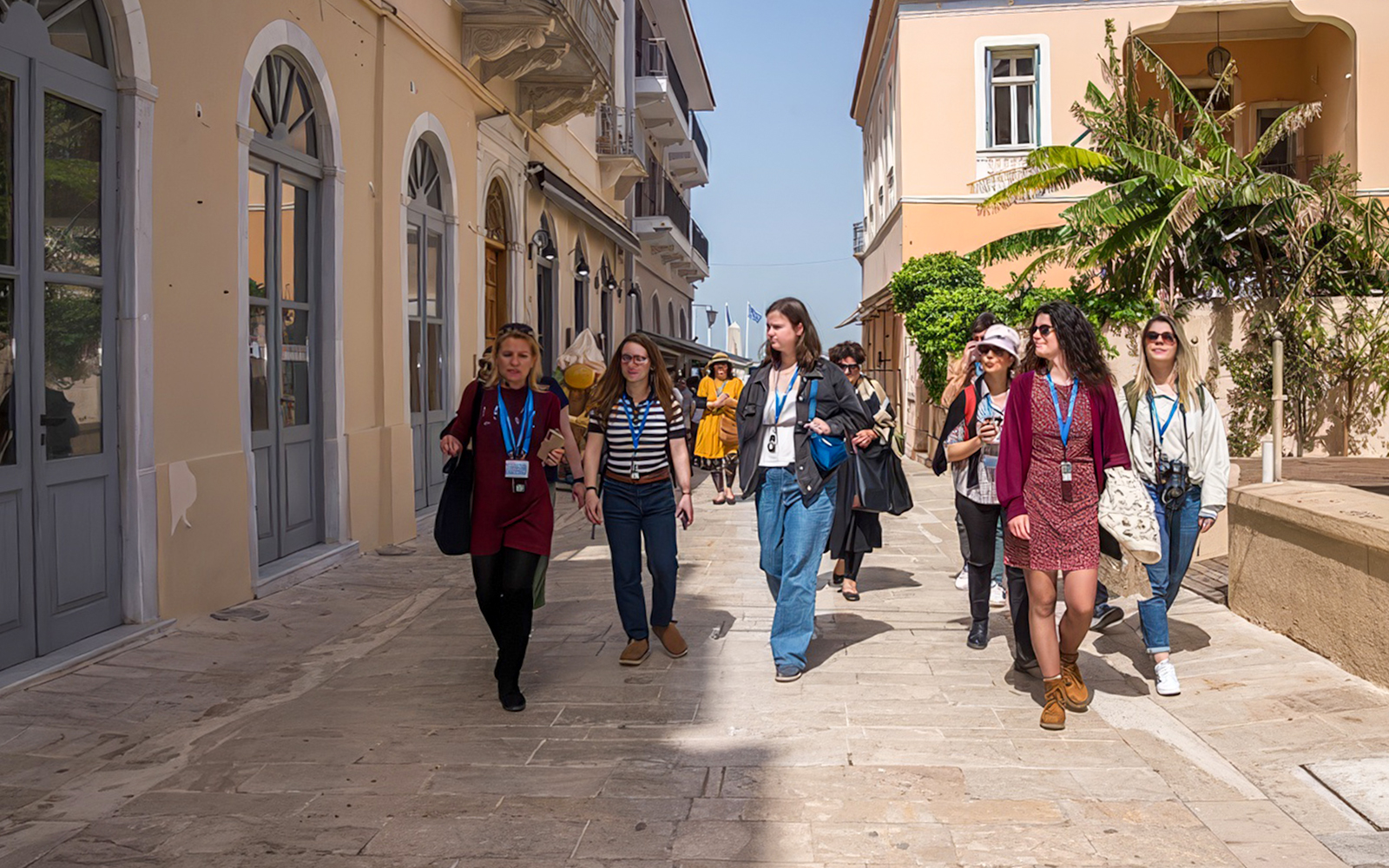 Tour guide leading guests through a street in Nafplion during Ancient Mycenae & Nafplion Premium Tour.