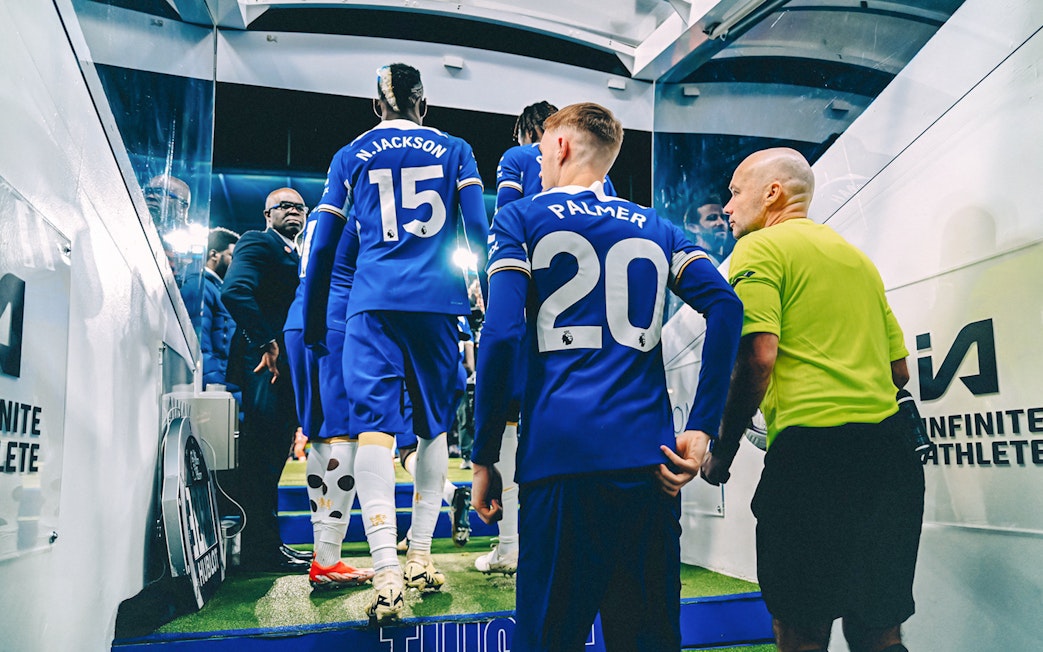 Chelsea FC players entering the stadium tunnel during a tour.
