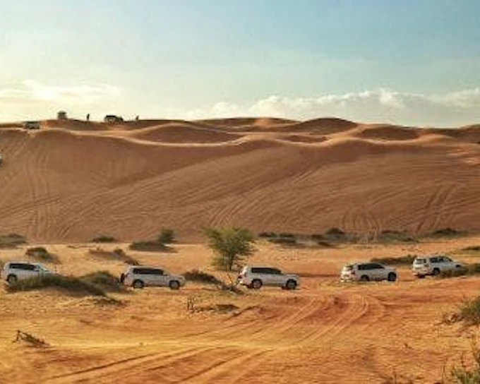 Ras Al Khaimah Desert Safari with Dune Bashing, Camel Ride, Sand Boarding, BBQ Dinner, and Transfers