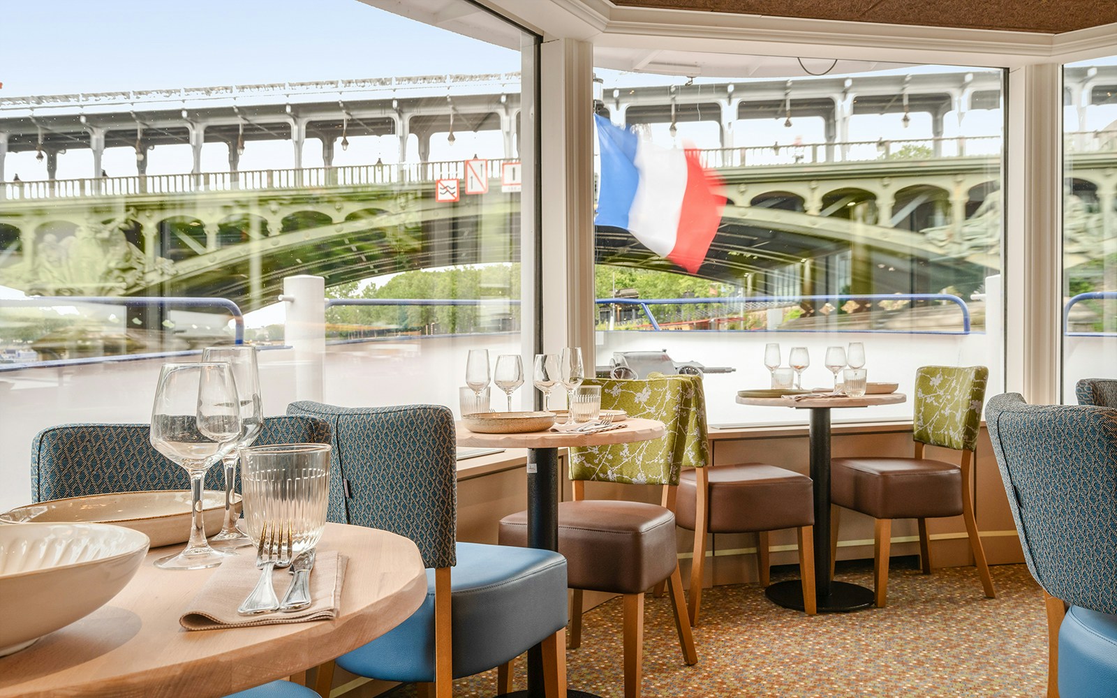 Seine River dinner cruise with Capitaine Fracasse, Paris, Eiffel Tower illuminated at night.