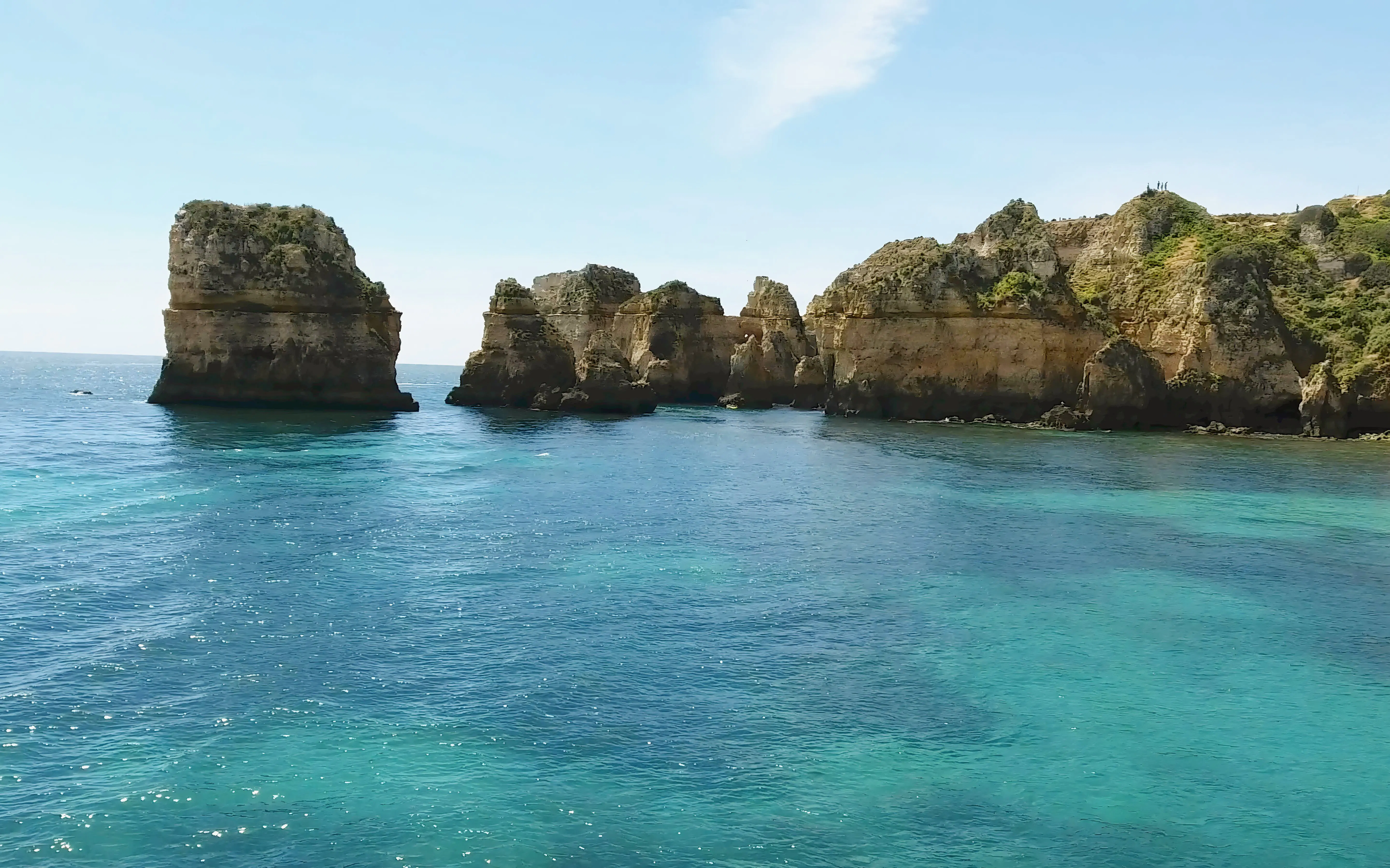 Ponta da Piedade cliffs and turquoise waters on a private cruise in Lagos, Portugal.