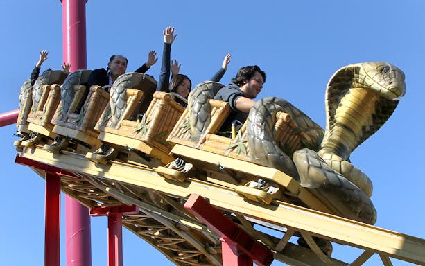 Roller coaster with snake-themed cars at Six Flags Discovery Kingdom.