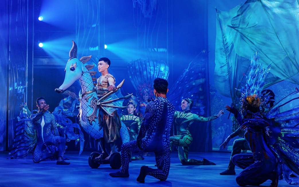 Performers in aquatic costumes during Varuna, Underwater Theatrical Dining Experience.