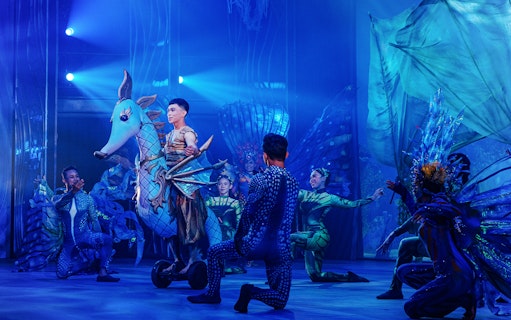 Performers in aquatic costumes during Varuna, Underwater Theatrical Dining Experience.