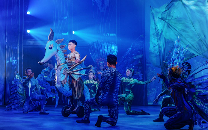 Performers in aquatic costumes during Varuna, Underwater Theatrical Dining Experience.