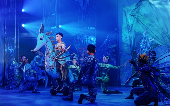 Performers in aquatic costumes during Varuna, Underwater Theatrical Dining Experience.