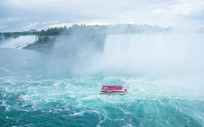 Boat approaching Niagara Falls on the Voyage to the Falls tour, Canada.