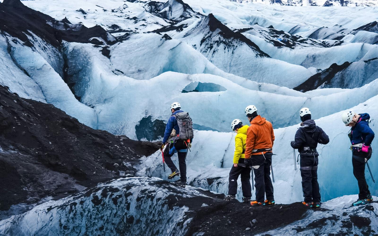 Guests hiking on Sólheimajökull glacier in Iceland.