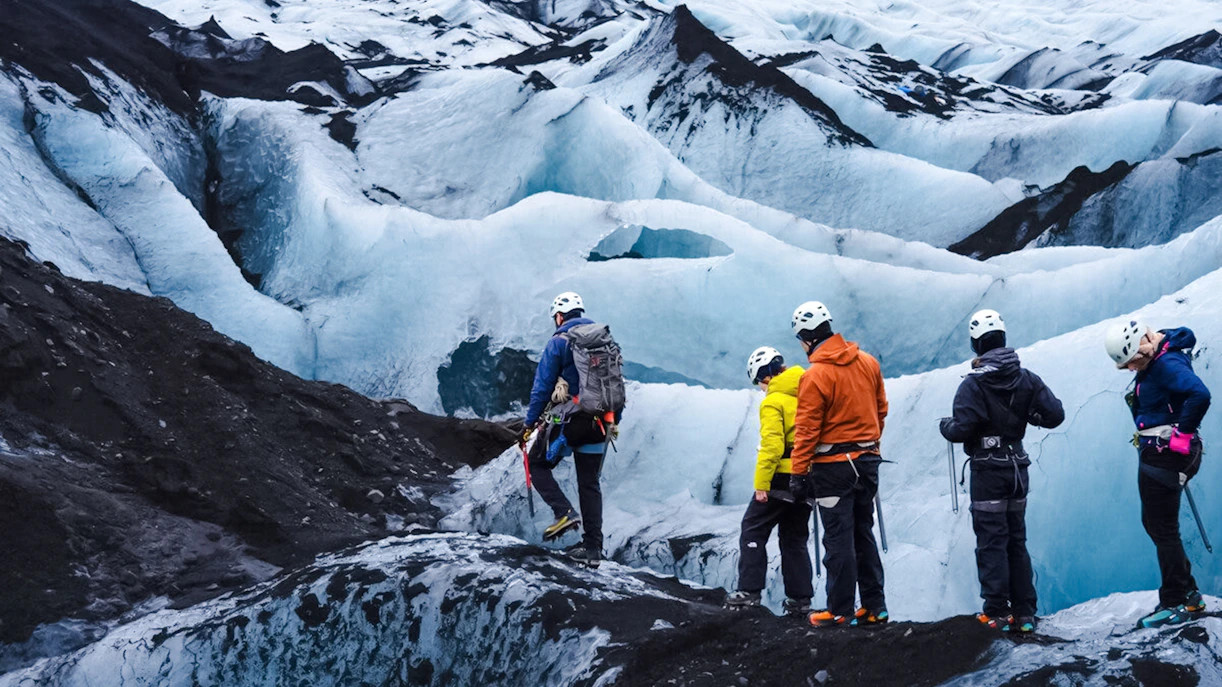 Guests hiking on Sólheimajökull glacier in Iceland.