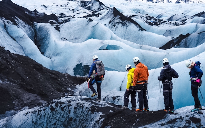 Guests hiking on Sólheimajökull glacier in Iceland.