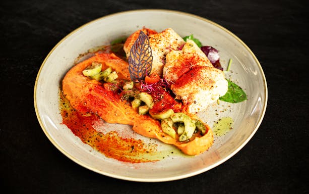 Plate of gourmet dish served on Danube River dinner cruise.