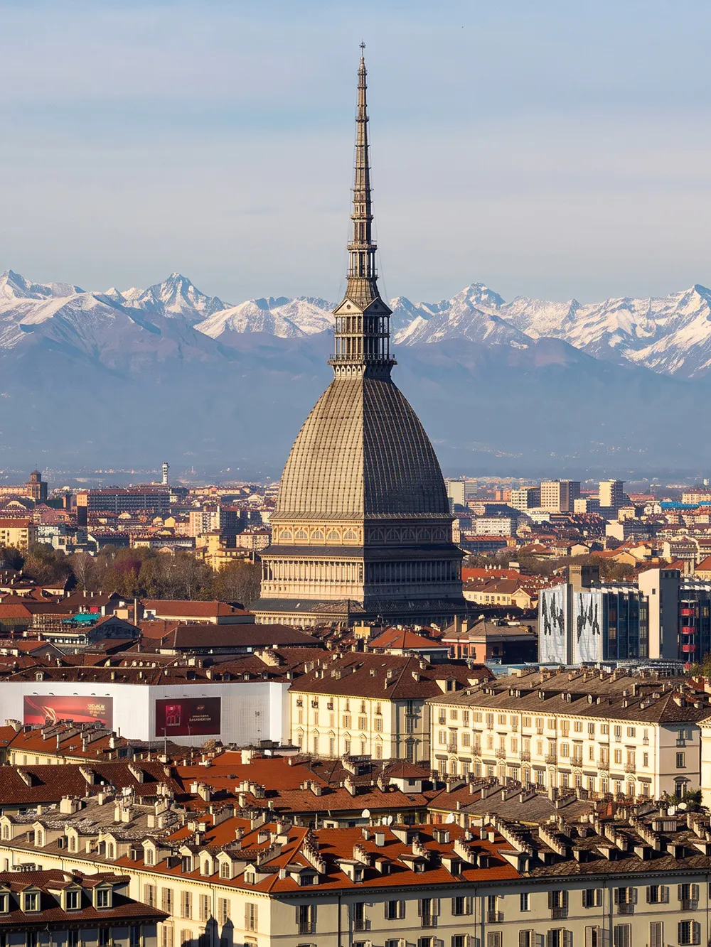 Mole Antonelliana with Alps backdrop, Turin, home to National Cinema Museum.