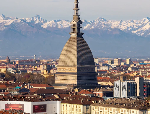 Mole Antonelliana with Alps backdrop, Turin, home to National Cinema Museum.