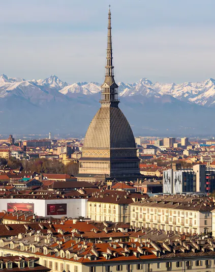 Mole Antonelliana with Alps backdrop, Turin, home to National Cinema Museum.