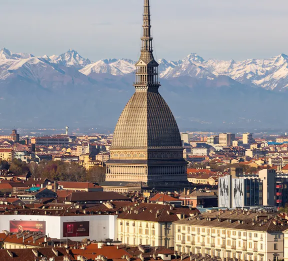 Mole Antonelliana with Alps backdrop, Turin, home to National Cinema Museum.