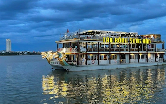 Tau Rong Song Han cruise boat on a river at dusk, Dubai weekend tour.