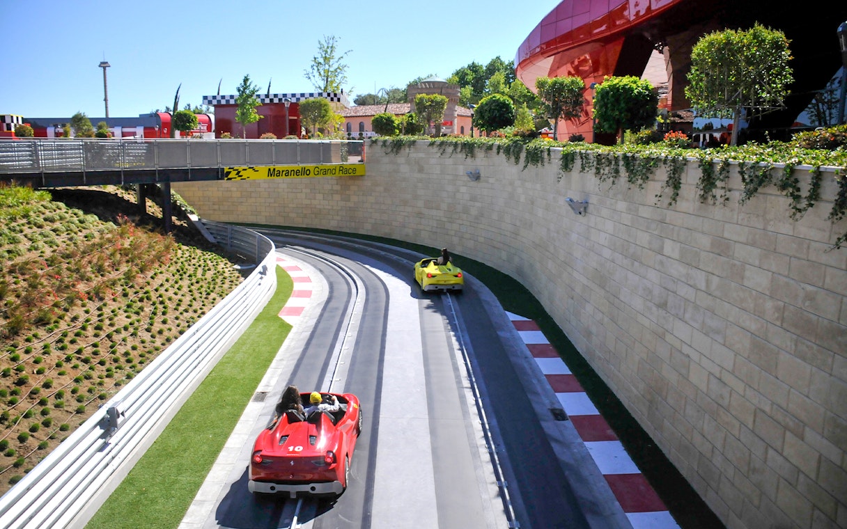 Racetrack with red and yellow cars at PortAventura World, Barcelona.