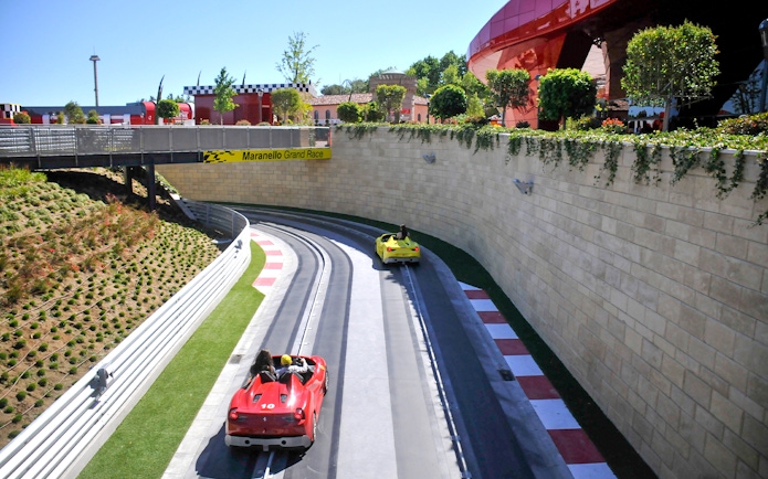 Racetrack with red and yellow cars at PortAventura World, Barcelona.