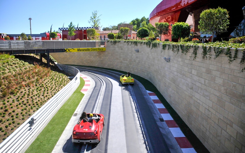 Racetrack with red and yellow cars at PortAventura World, Barcelona.