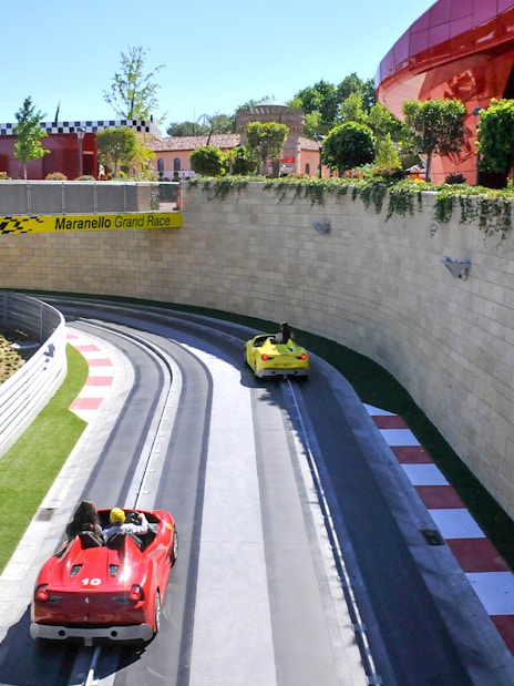 Racetrack with red and yellow cars at PortAventura World, Barcelona.