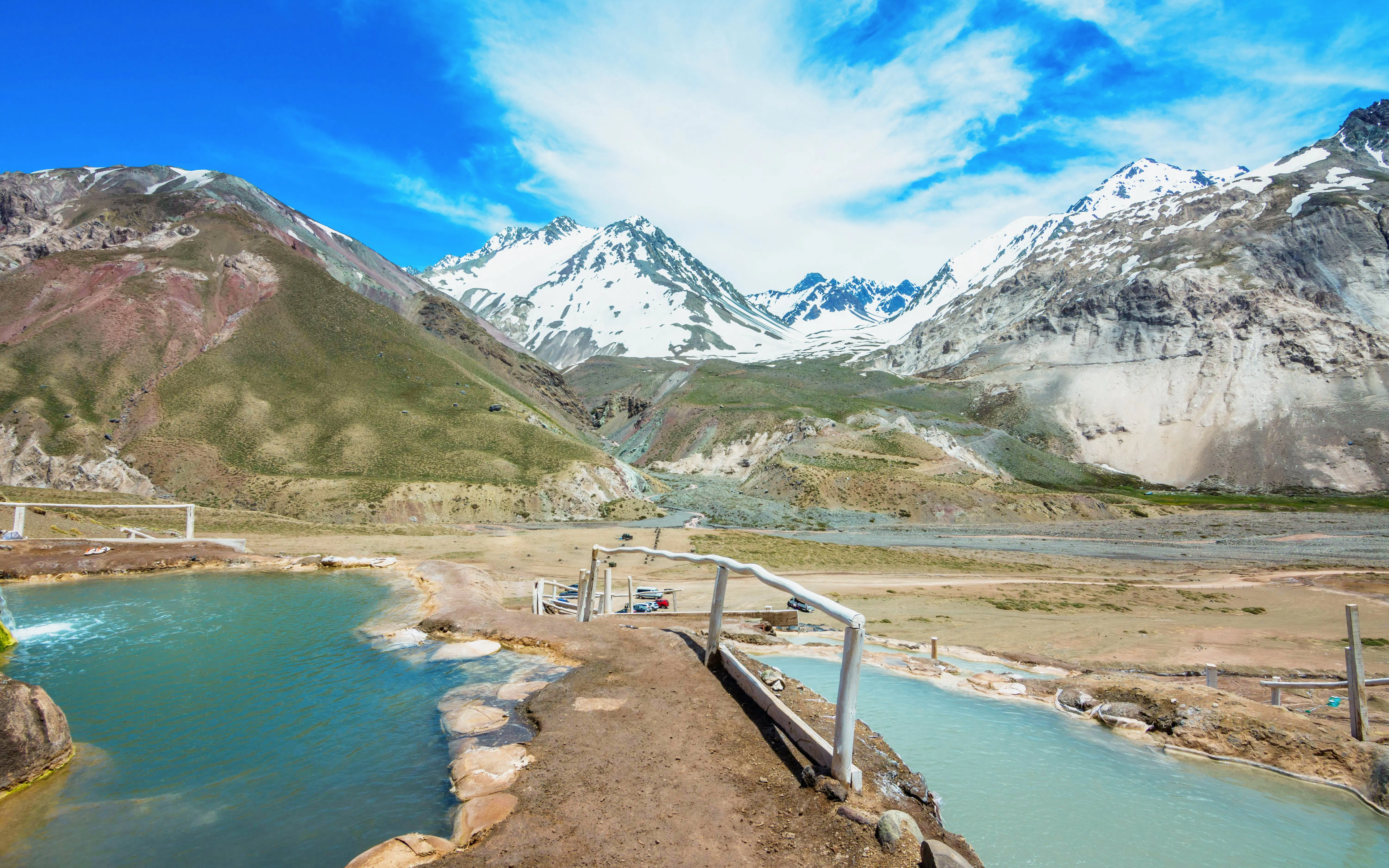 Natural hot springs at Termas Colina with Andes mountains in Cajon del Maipo, Chile.