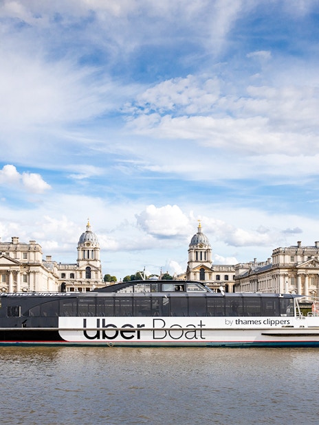 Uber Boat cruising past the Old Royal Naval College in London.