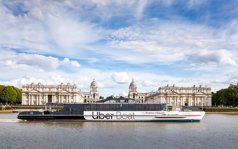 Uber Boat cruising past the Old Royal Naval College in London.