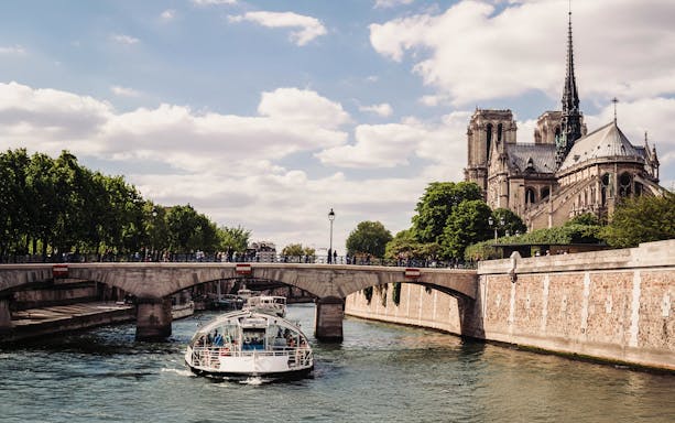 Seine River cruise near Notre-Dame Cathedral on Île de la Cité, Paris.