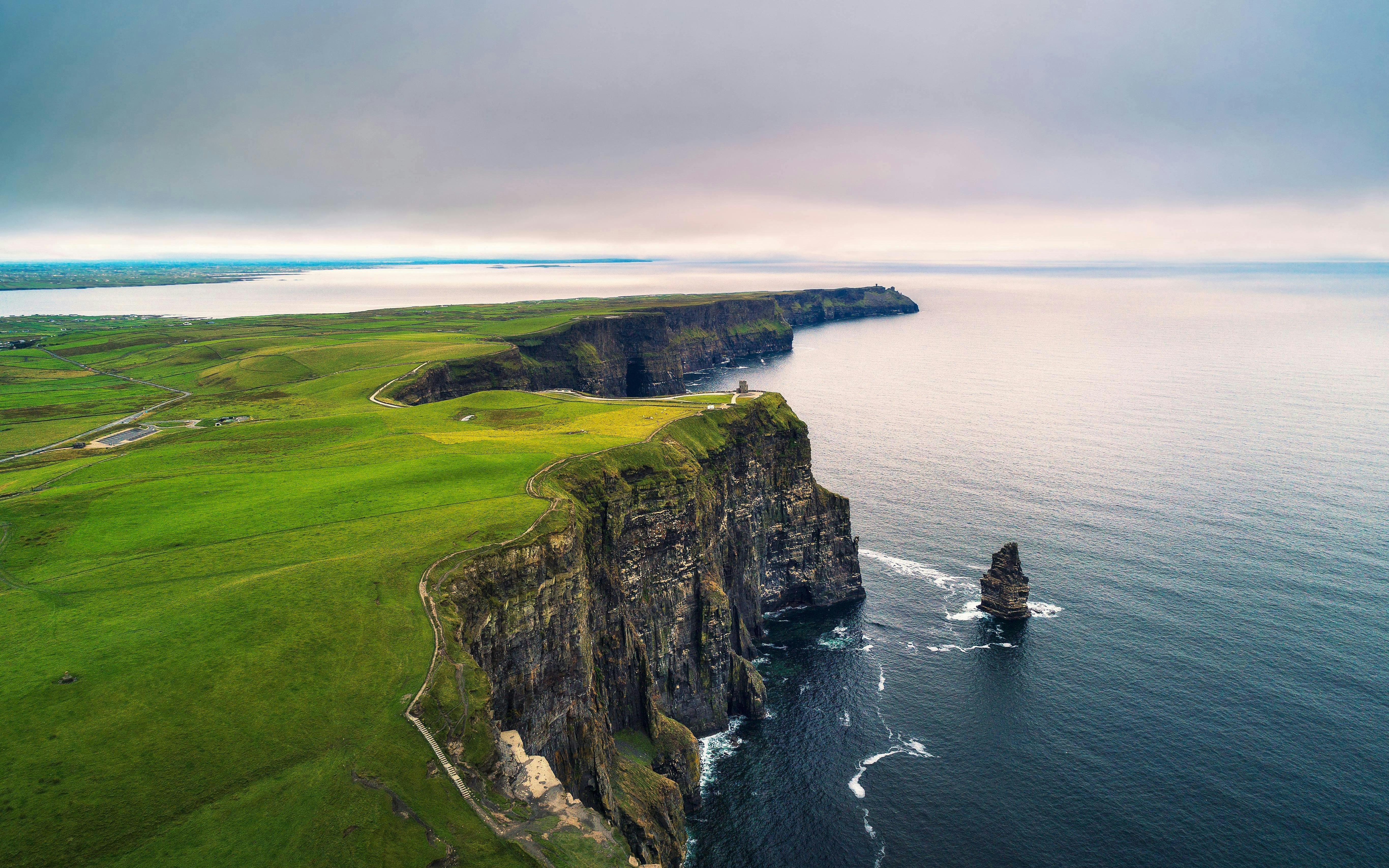 Cliffs of Moher, Ireland, with rugged cliffs and Atlantic Ocean view.