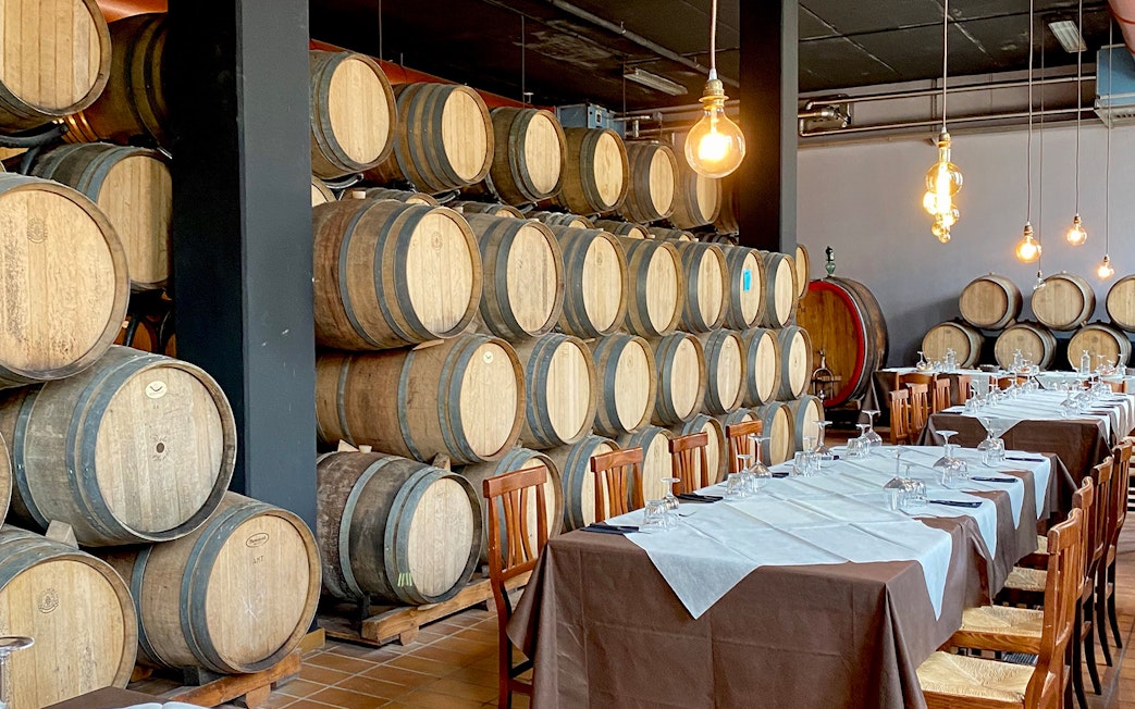 Wine barrels and dining setup in a Chianti vineyard, Florence tour.