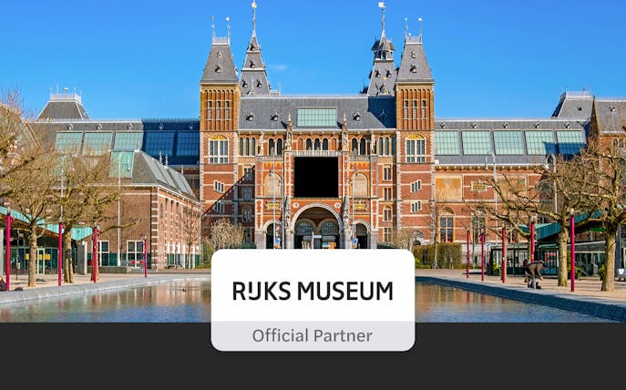 Rijksmuseum exterior with visitors, Amsterdam, part of Skip The Line Combo City Canal Cruise tour.