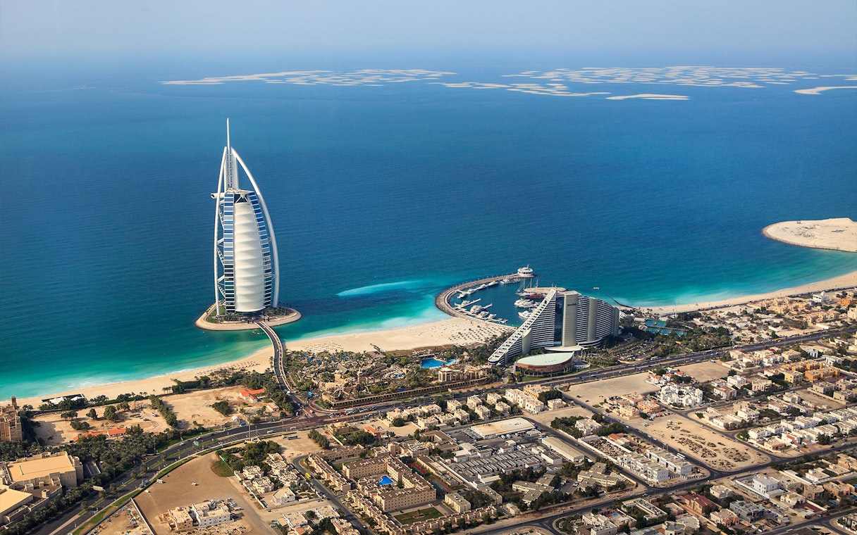 Aerial view of Burj Al Arab and coastline in Dubai for self-guided audio tour.