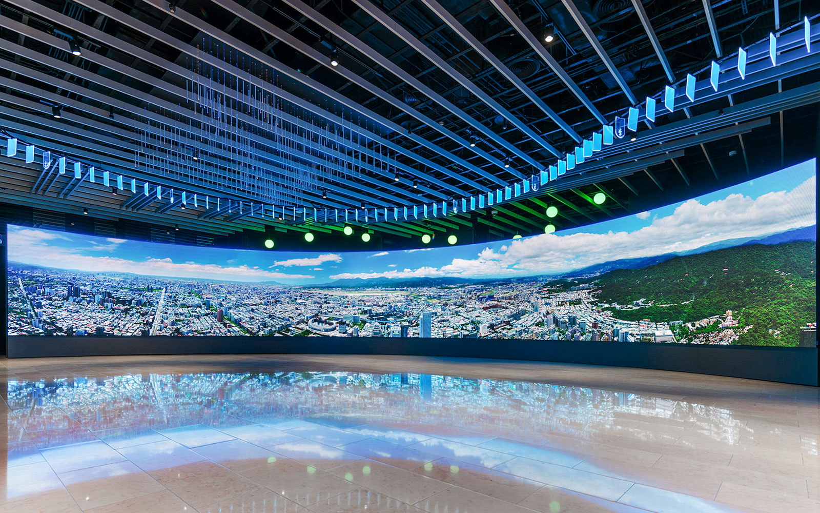 Panoramic view of Taipei cityscape displayed inside Taipei 101 observatory.