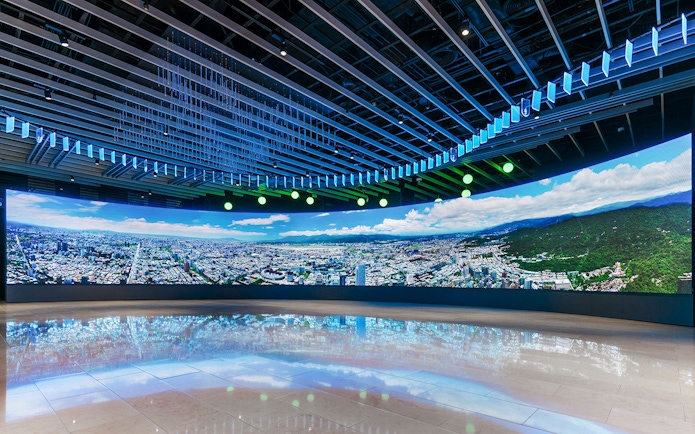 Panoramic view of Taipei cityscape displayed inside Taipei 101 observatory.