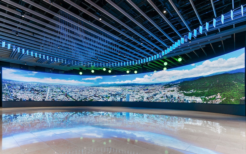 Panoramic view of Taipei cityscape displayed inside Taipei 101 observatory.