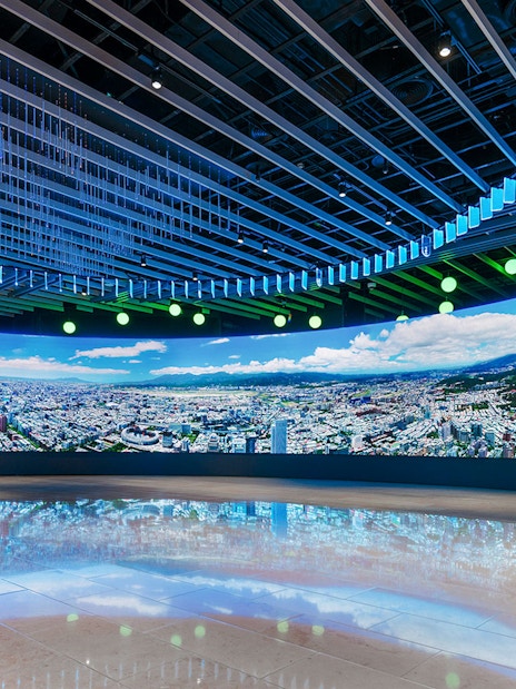 Panoramic view of Taipei cityscape displayed inside Taipei 101 observatory.