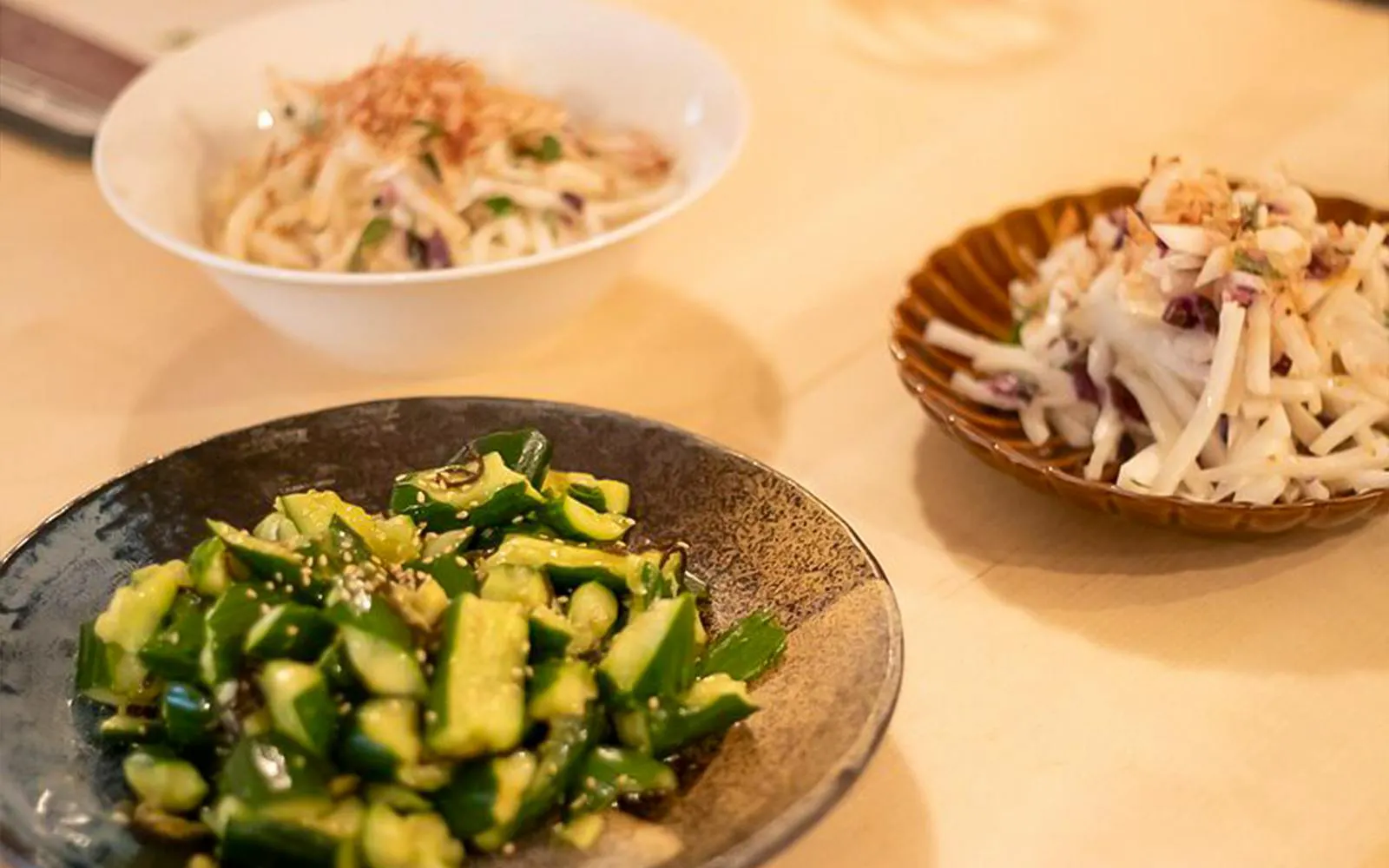 Cucumber salad and root vegetable dishes prepared in a Tokyo izakaya-style cooking class.