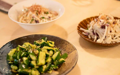 Cucumber salad and root vegetable dishes prepared in a Tokyo izakaya-style cooking class.