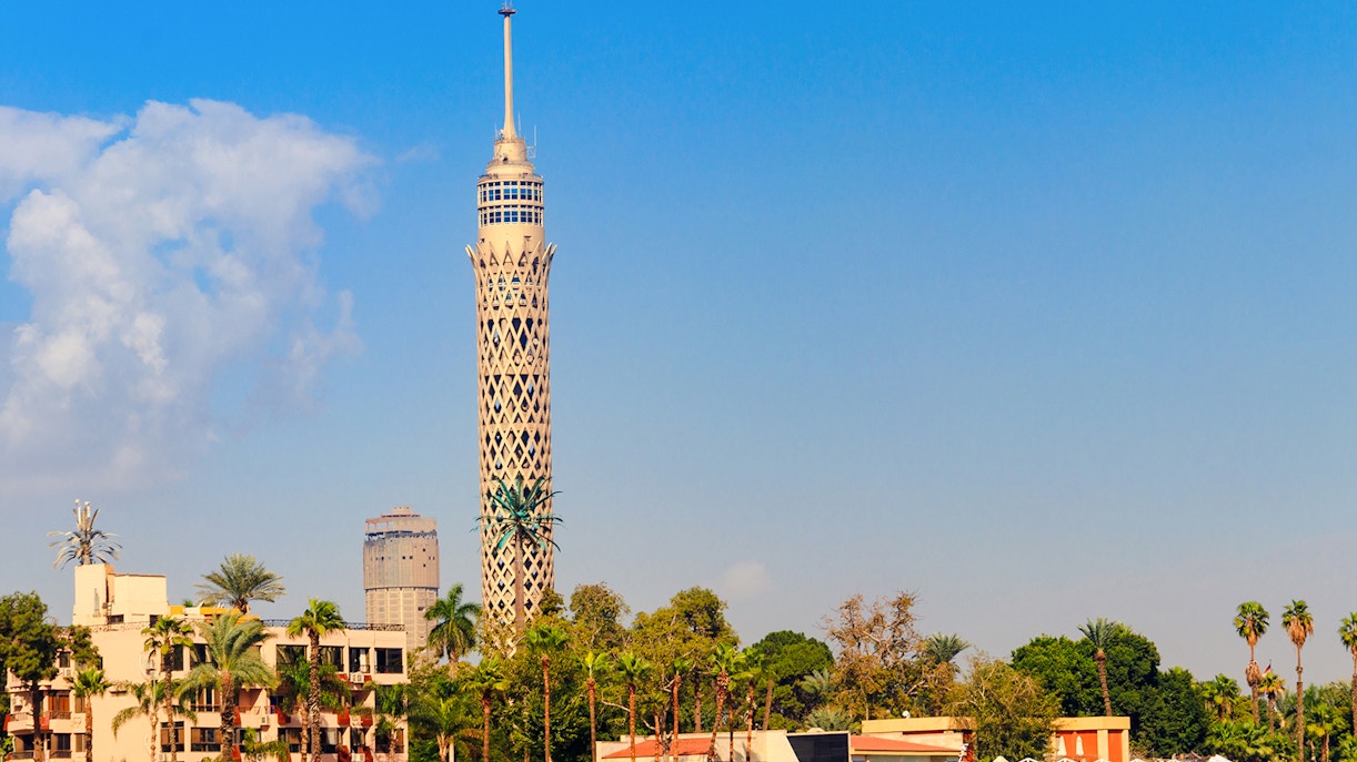 Cairo Tower rising above lush greenery in Cairo, Egypt.