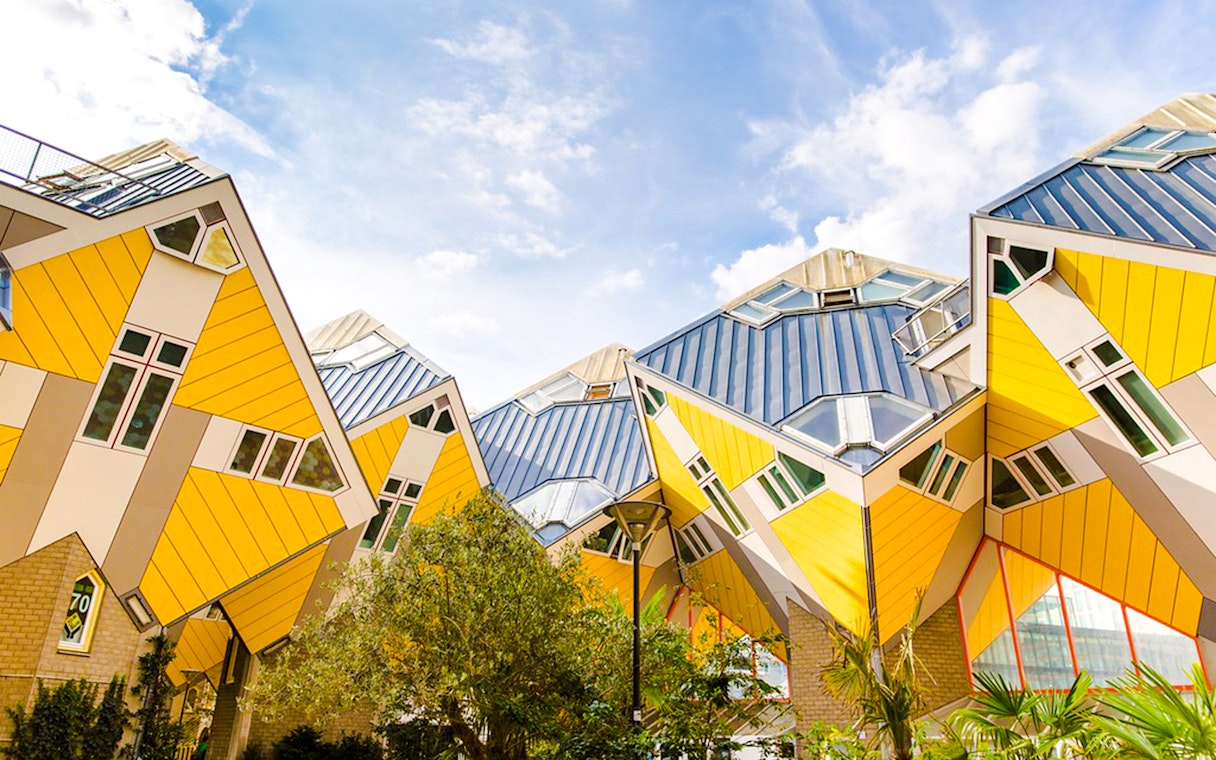 Rotterdam Cube Houses with yellow and white geometric design under blue sky.