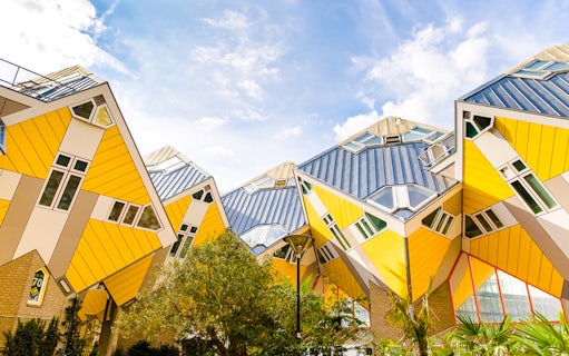Rotterdam Cube Houses with yellow and white geometric design under blue sky.