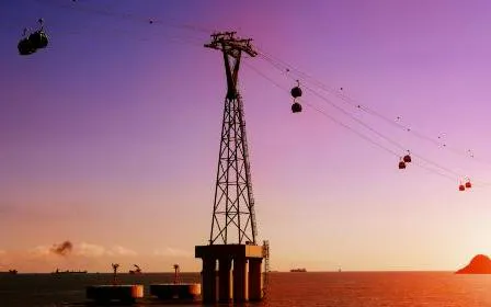 Cable cars over water at sunset in Dubai, part of Big 3 Pass tour.