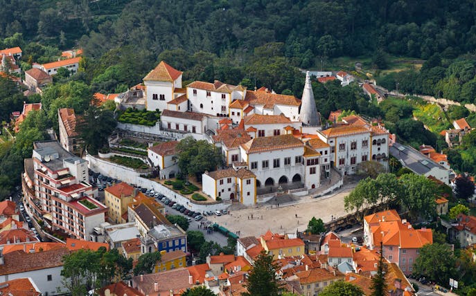 National Sintra Palace aerial view with surrounding gardens and town, Sintra, Portugal.