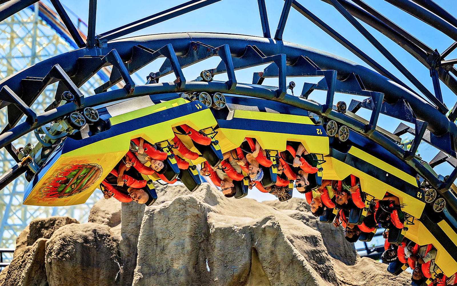 Roller coaster riders upside down on the Demon at Six Flags Great America.
