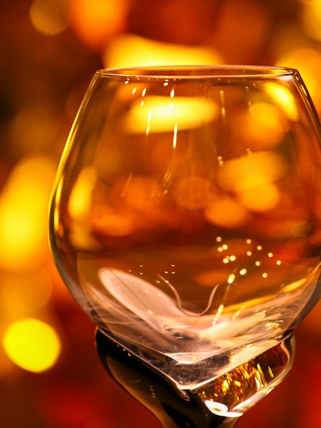 Whisky tasting glass with amber liquid at Whisky Tour & Tasting.