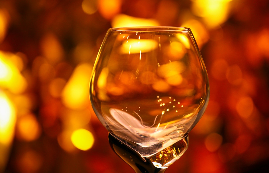 Whisky tasting glasses arranged on a table at a distillery tour in Scotland.