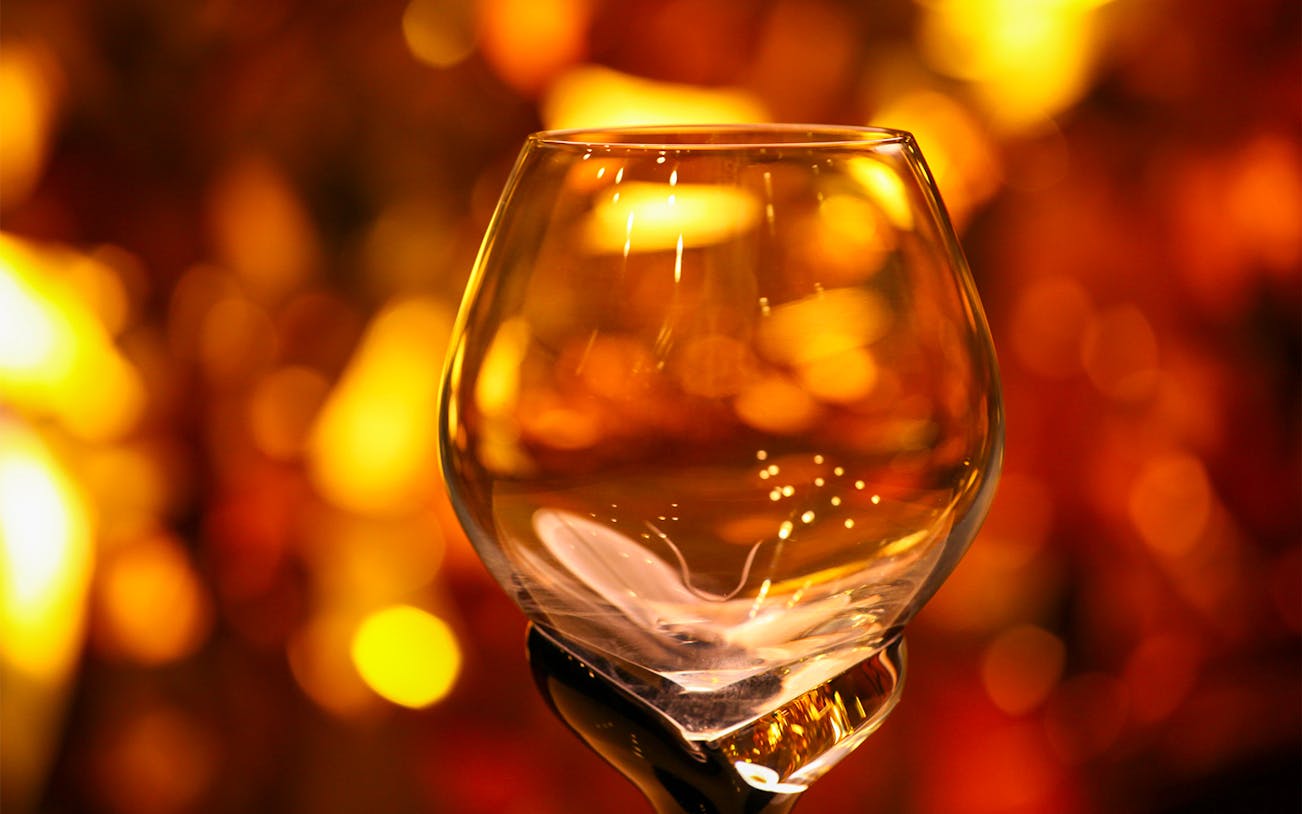 Whisky tasting glasses arranged on a table at a distillery tour in Scotland.