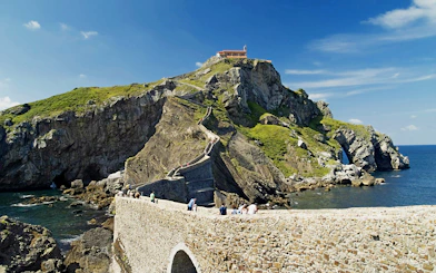 Pathway leading to Hermitage of San Juan de Gaztelugatxe on rocky hill in Vizcaya, Spain.