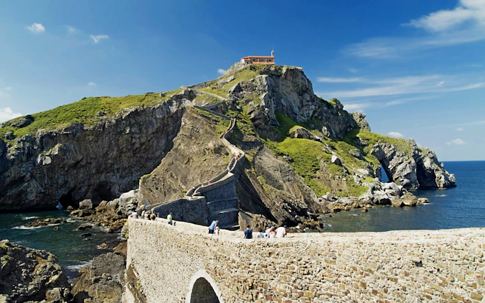 Pathway leading to Hermitage of San Juan de Gaztelugatxe on rocky hill in Vizcaya, Spain.