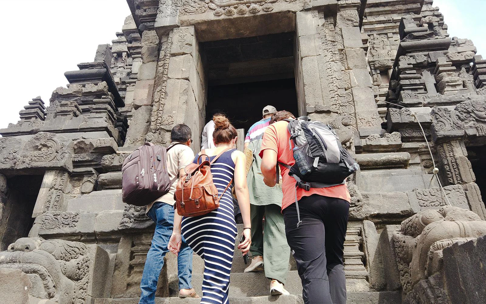 Visitors ascending steps at Prambanan Temple, Indonesia, during the Ultimate Temple Run tour.